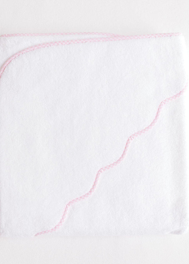 White towel with pink stitching on a white background