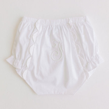 Whitediaper cover with embroidery on a light gray background